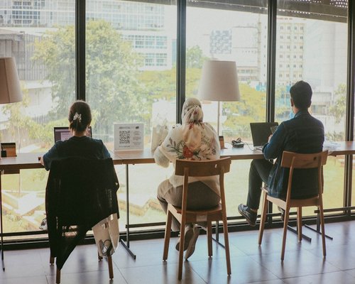 Group of diverse professionals having a meeting in modern Jakarta office workspace